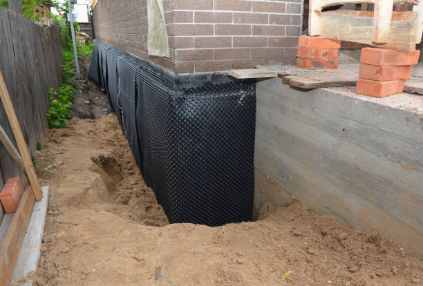 Happy homeowners after waterproofing job in Brillion
